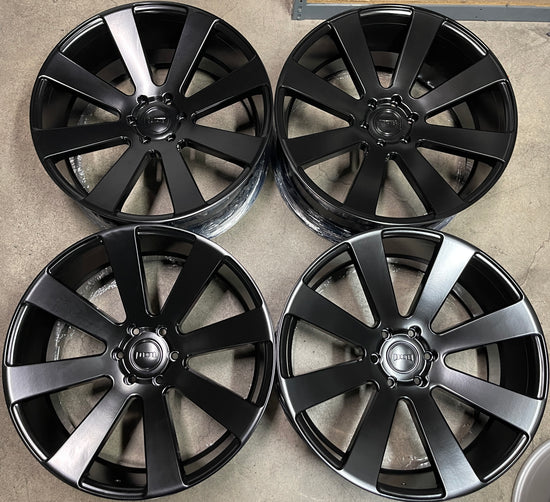 A set of four satin black DUB 8Ball 24 wheels for vehicles, displayed without tires and including center caps.