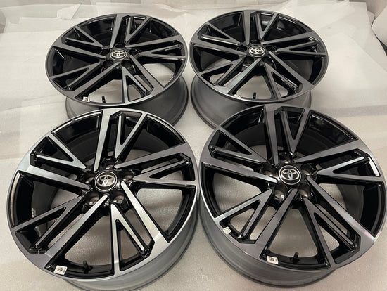 Set of four Toyota Camry XSE OEM wheels with gloss black pockets, machined spoke faces and Toyota center caps.