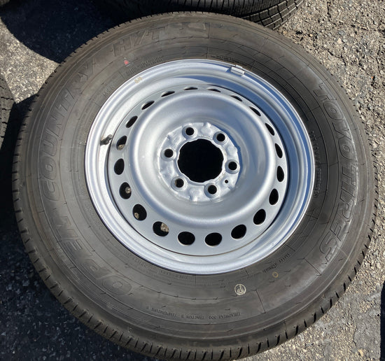 Four Take Off 2024 2025 Factory Toyota Tacoma OEM steel wheels on 245/70/17 Toyo tires.