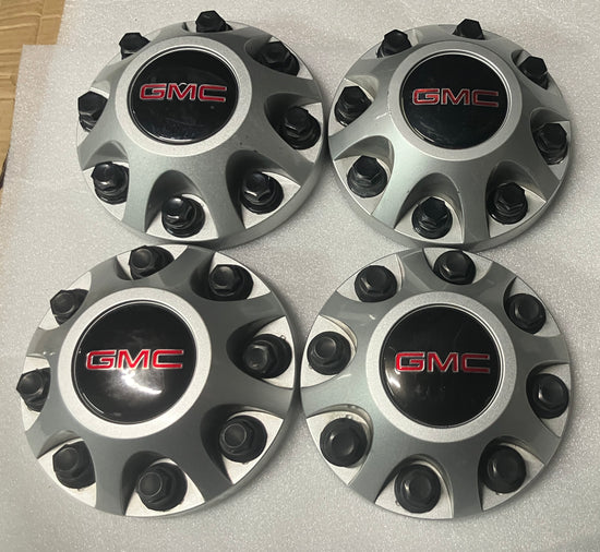 Set of 4 GMC Sierra 2500 center caps silver 9597819
