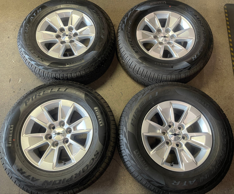 2019-2026 Chevy Silverado 1500 GMC Sierra 1500 17" Silver OEM Wheel Rim Tire Set of 4 — 17x8 | Pirelli Scorpion ATR 265/70R17 | Part# 23377010