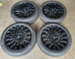 Four Hyundai Palisade Calligraphy OEM 21-inch gloss black multi-spoke wheels with Pirelli tires and Hyundai center caps.