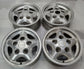 “Set of four used silver Land Rover OEM five-spoke wheels with three center caps and visible rim wear.”

