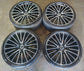 Set of four Mercedes-Benz AMG 21-inch multi-spoke wheels with machined faces, black pockets, mounted tires and Mercedes center caps.