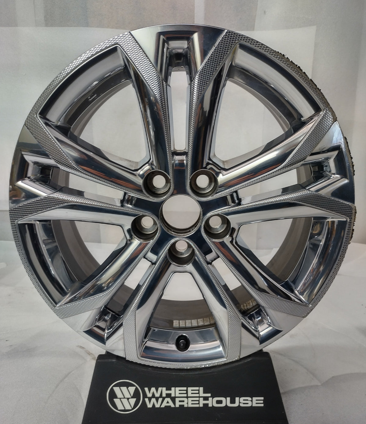 used Toyota Sienna 18-inch chrome clad split-spoke OEM wheel with five lug holes and visible rim blemishes