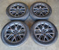 Set of four Ford Expedition dark gray 22-inch multi-spoke OEM wheels with Michelin tires and Ford center caps.