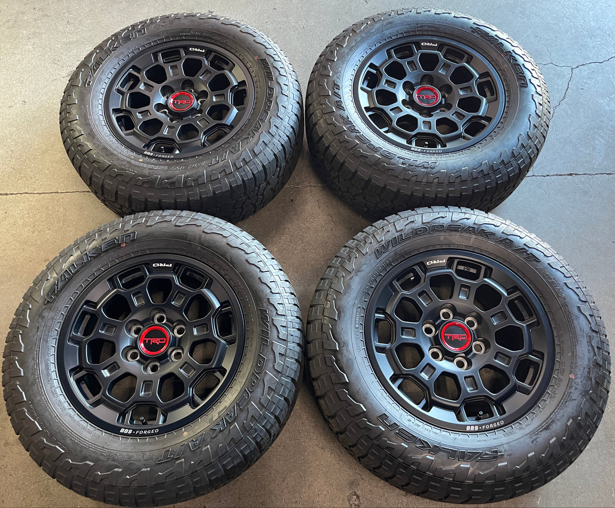 2022-2026 Toyota Tundra TRD BBS forged OEM 18x7.5 Semi Gloss Black Wheel Rim Tire Set of 4, OEM PT960342202F, interchange 69195, Falken WildPeak AT3WA 285/65R18 116T tires with approximately 99% tread, center caps included

