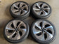 Four Lincoln Navigator 24-inch machined bronze OEM wheels with Goodyear tires and Lincoln center caps.