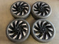 Four black and silver Lincoln Nautilus OEM wheels with mounted Goodyear tires and Lincoln center caps