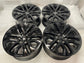 Set of four gloss black Ford F150 Lariat OEM multi-spoke wheels with Ford center caps.