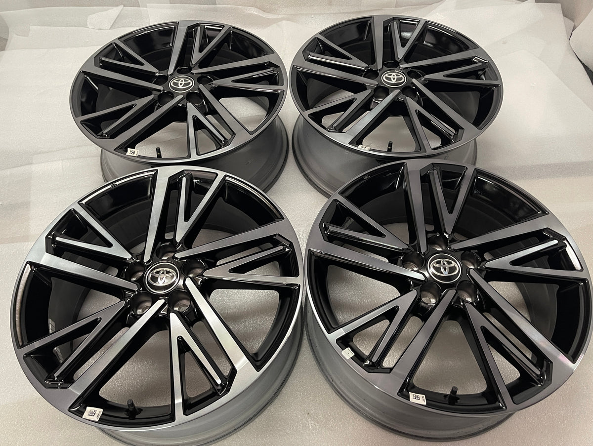 Set of four Toyota Camry XSE OEM wheels with gloss black pockets, machined spoke faces and Toyota center caps.