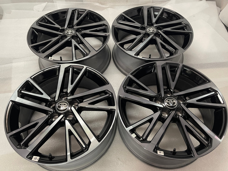 Set of four Toyota Camry XSE OEM wheels with gloss black pockets, machined spoke faces and Toyota center caps.