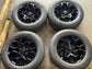 Four Ford F-150 OEM 18" gloss black wheels with Ford center caps and Hankook Dynapro H/T tires