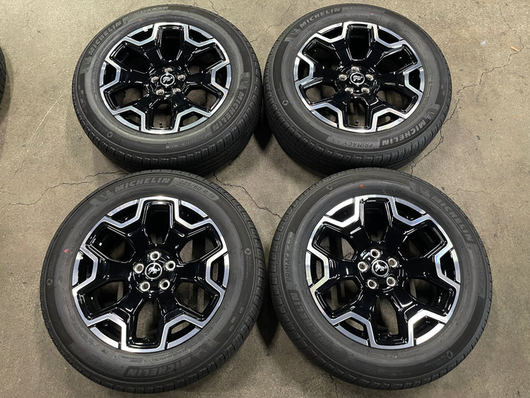 Four Ford Bronco Sport machined and gloss-black OEM wheels with Michelin Primacy A/S tires, arranged in two rows.