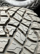 2026 RAM 1500 RHO TRX OEM 18" Black Wheel/Rim Tire Set of 4 | 6VB84TRMAA Goodyear Territory AT LT325/65R18