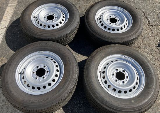 Four Take Off 2024 2025 Factory Toyota Tacoma OEM steel wheels on 245/70/17 Toyo tires.