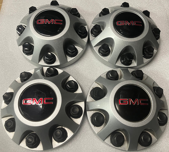 Set of 4 GMC Sierra 2500 center caps silver 9597819